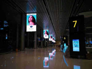 Digital signage displays showing advertisements and information in a modern indoor space